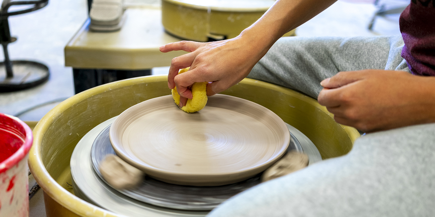 Students rolling ink for printing Students rolling ink for printing