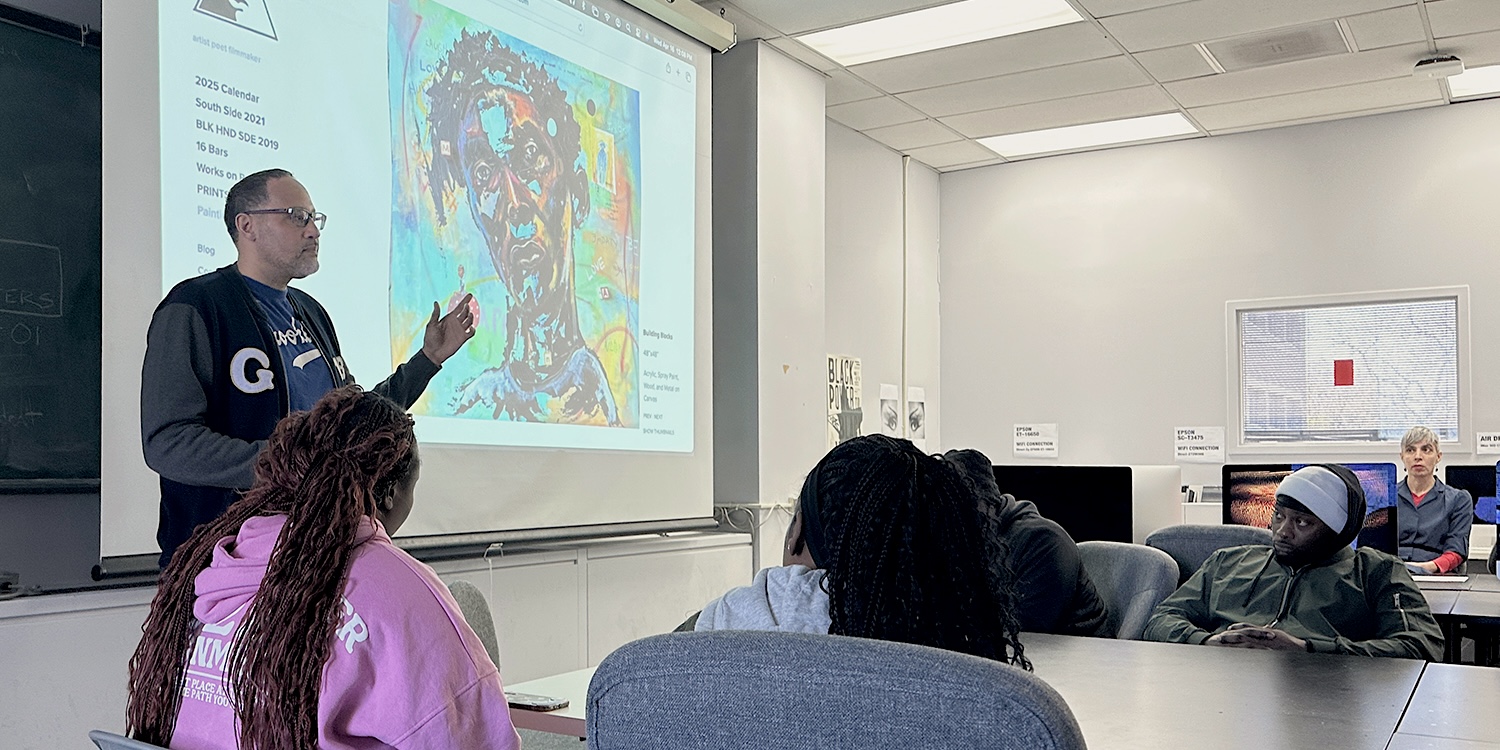 Visiting Artist taking with students about artwork