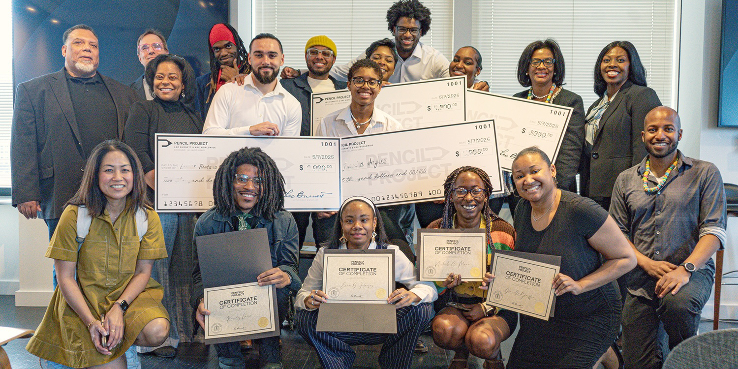 Group of students and faculty displaying scholarship checks Group of students and faculty displaying scholarship checks