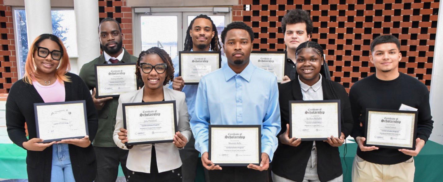 ComEd Scholarship recipients pose for a photo with their scholarship certificates.