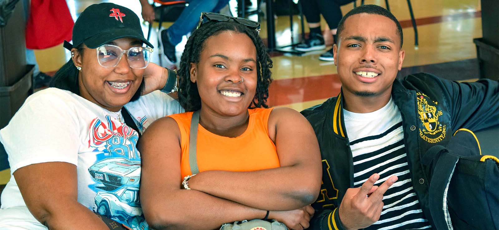 3 students sitting on couch