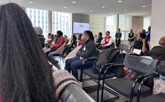 Audience sitting in rows at Spark Foundry’s corporate office event.
