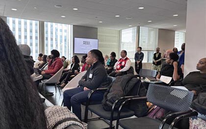Audience sitting in rows at Spark Foundry’s corporate office event.