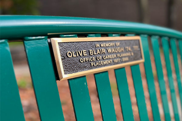 Green bench with name of donor