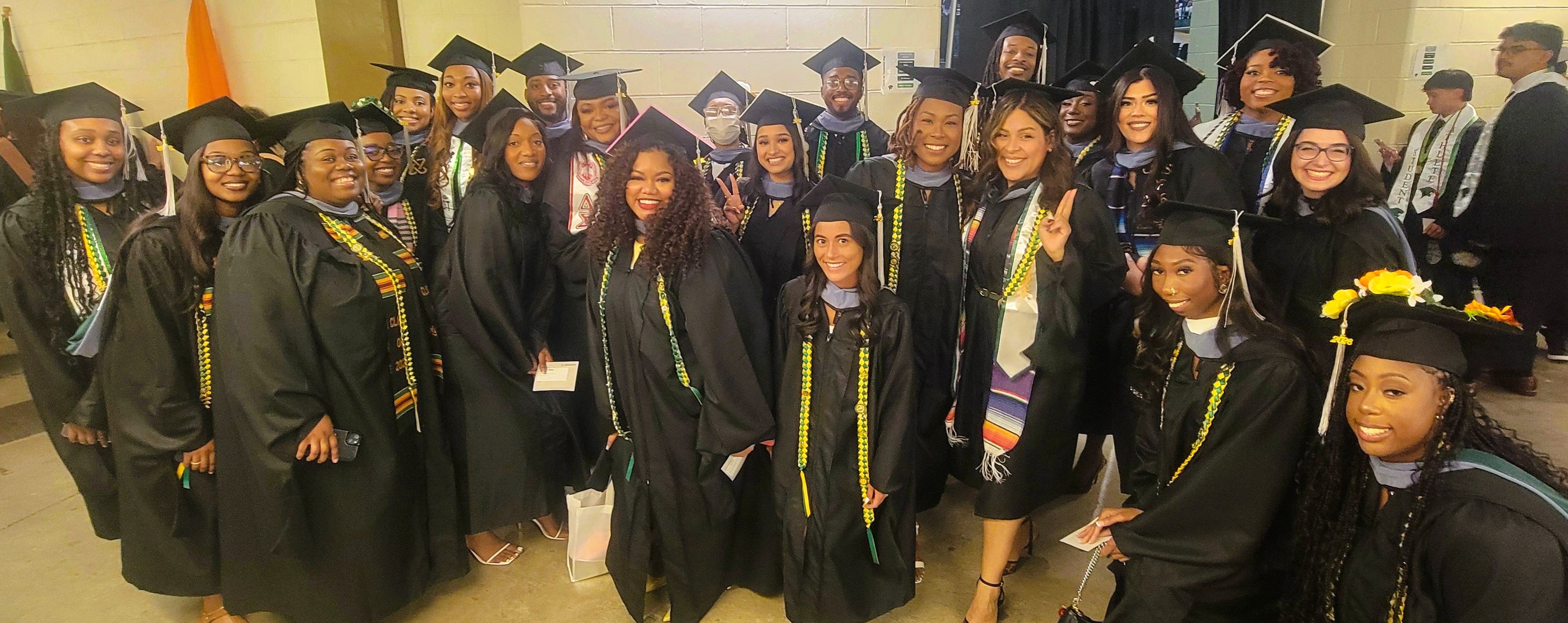 Group photo of the 2026 Master of Occupational Therapy graduates in caps and gowns.