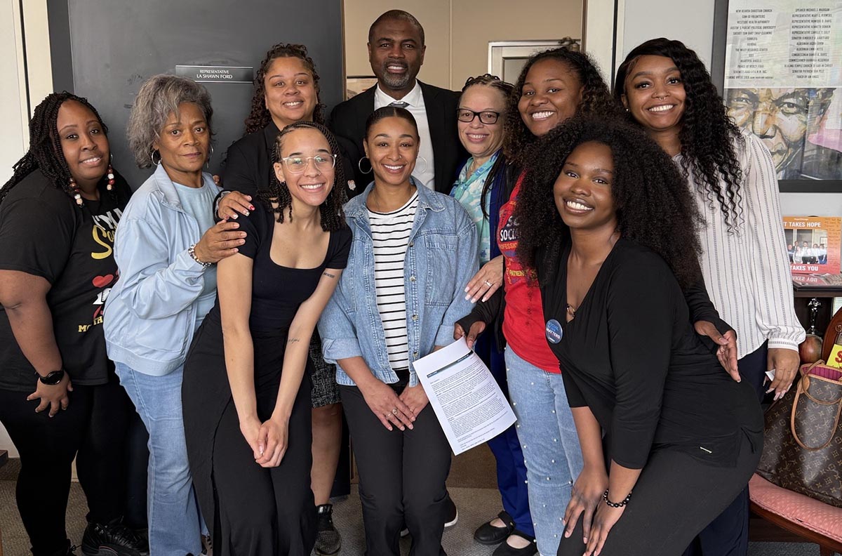 Members of the Graduate Student Association gather for a photo with Illinois State Representative La Shawn Ford outside of his office at the Illinois State Capitol.