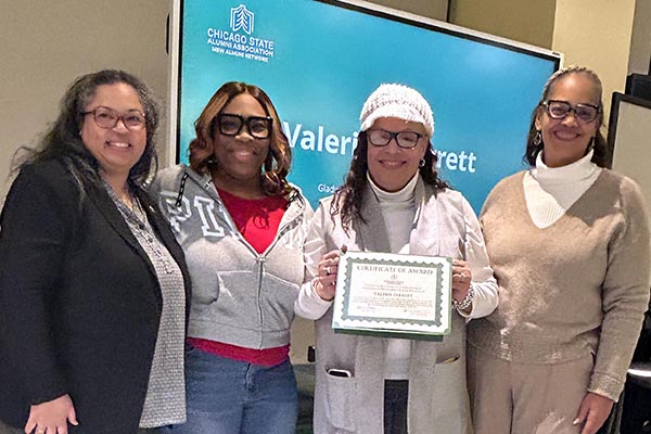 Social Work faculty and pose for a photo with Valerie Jarrett, recipient of the Gladys Scott Community Service Scholarship.